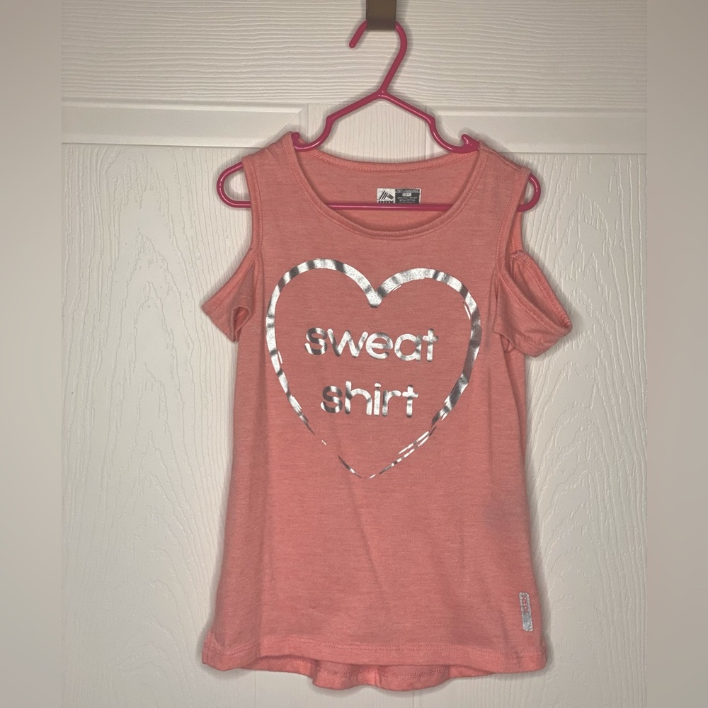 Girls RBX 6x performance tank with key hole sleeves.
